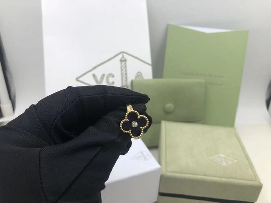 गुणवत्ता वैन क्लीफ एंड अर्पेल्स विंटेज अलहम्ब्रा रिंग येलो गोल्ड गोमेद गोल डायमंड कारखाना